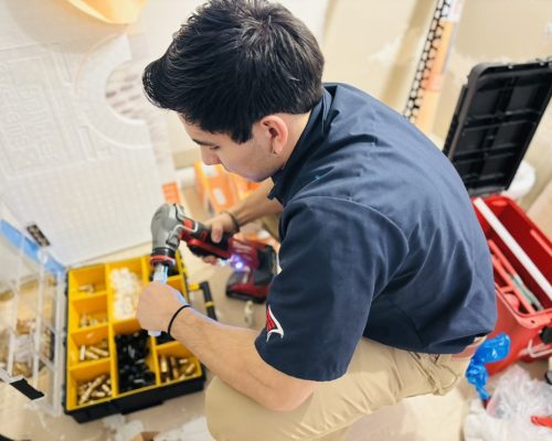 A plumber is in very serious vibes while working using his toolkit